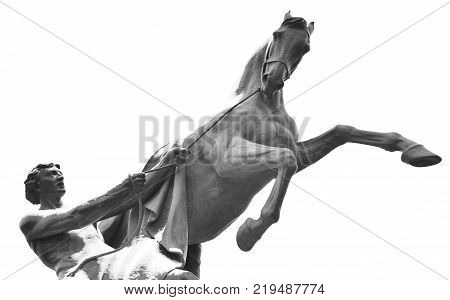 Statue of the conquest of a horse on the Anichkov Bridge in St.Petersburg Russia. Black and white.