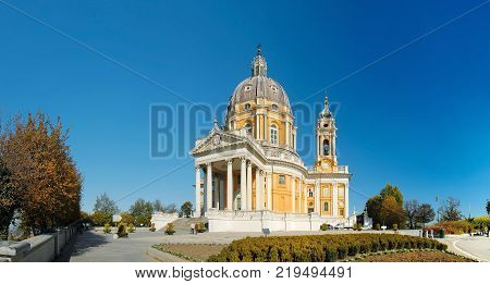 ITALY, TORINO, NOV. 11, 2011: View on beautiful white orange church Superga in italian Alps mountains. Italian Superga cathedral church. Famous Italian baroque architecture.