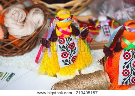 traditional Ukrainian folk doll motanka on table