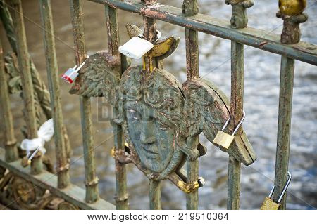 Cast Iron Fence with Winged Angel Face and Locks