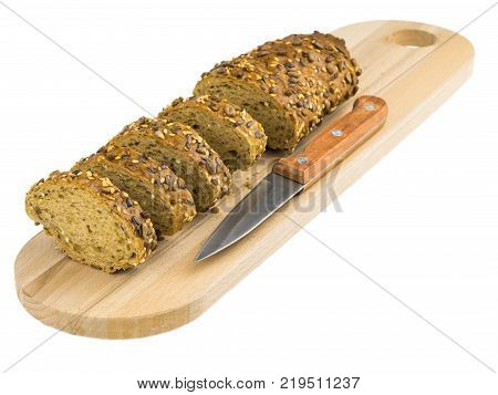 Freshly baked bread from wheat flour with sunflower seeds, pumpkin, sesame isolated on a white background. Baking for a healthy diet.