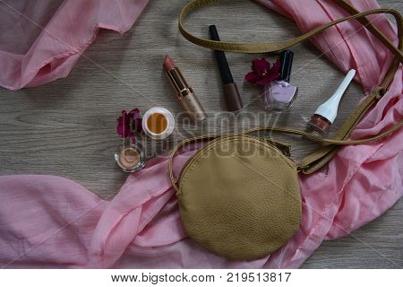 women's cosmetic bag and lipstick, shadows, cream and varnish