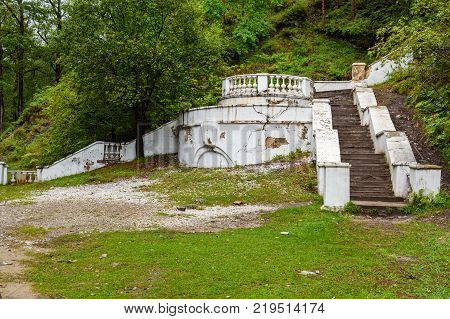 Old white concrete stairs in Arshan. Buryatia. Russia