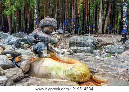 Source Of Mineral Water. Water Flows From Form Of Figures Of Boy With Jug. Arshan. Russia