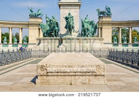 Monument (cenotaph) for the memory of our heroes in front of the statue of Arpad and his fellow Magyar chieftains on the Heroes' Square - Budapest, Hungary