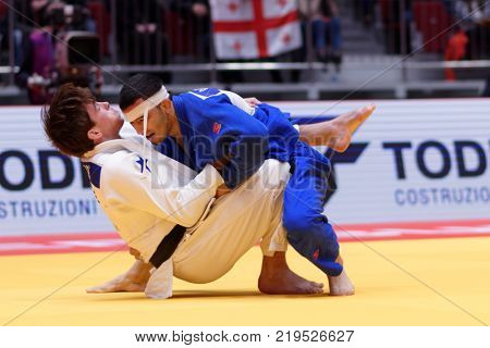 ST. PETERSBURG, RUSSIA - DECEMBER 16, 2017: Fight for 3rd place Tommy Macias, Sweden (white) vs Giyosjon Boboev, Uzbekistan during Judo World Masters tour. Macias won bronze medal