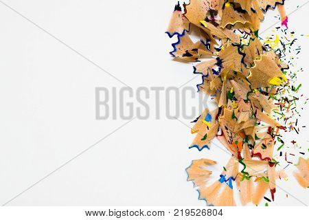 Debris from the sharpening on white background and copyspace on the left