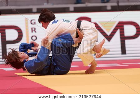 ST. PETERSBURG, RUSSIA - DECEMBER 16, 2017: Final fight Miku Tashiro (white) vs Nami Nabekura, both of Japan during Judo World Masters tour. Tashiro won gold medal