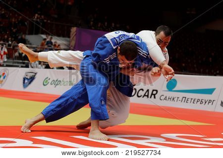 ST. PETERSBURG, RUSSIA - DECEMBER 17, 2017: Final fight Guram Tushishvili, Georgia (blue) vs David Moura, Brazil during Judo World Masters tour. Tushishvili won gold medal