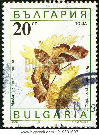 Ukraine - circa 2017: A postage stamp printed in Bulgaria shows Willowherb Hawkmoth Proserpinus proserpina. Series: Butterflies. Circa
