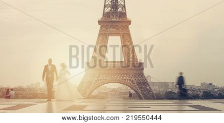 Wedding Couple in love at the Trocadero place in paris with the Eiffel tower in the background on sunset. ideal for websites and magazines layouts
