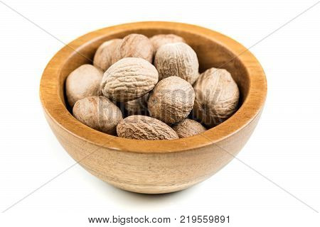 Pile Of Whole Dried Nutmeg Seed For Flavoring