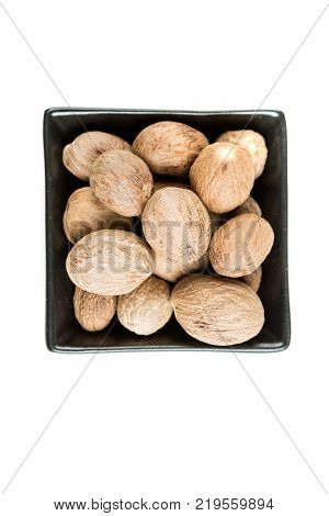 Pile Of Whole Dried Nutmeg Seed For Flavoring
