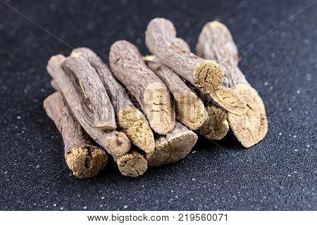 Pile Of Licorice Roots Isolated On A Black Background