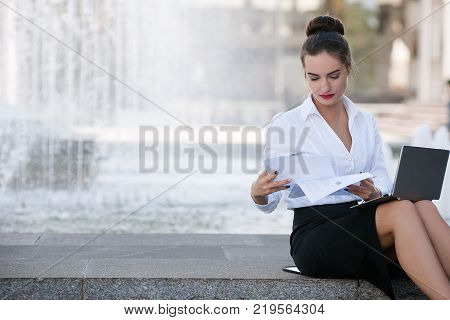 business woman lifestyle laptop outdoor paper work proccess concept