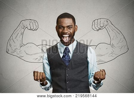Closeup portrait happy successful student business man winning fists pumped celebrating success isolated grey wall background. Positive human emotion facial expression. Life perception achievement