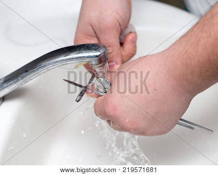 dentist washes tools in dentistry . Photos in the studio