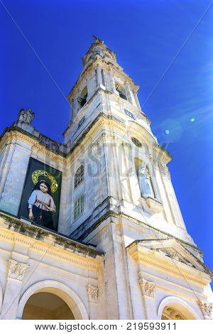 FATIMA, PORTUGAL  - SEPTEMBER 17, 2017 100th Celebration Mary's Appearance Basilica of Lady of Rosary Bell Tower Fatima Portugal. Church created on site where three Portuguese Shepherd children saw Virgin Mary of the Rosary. Basilica created in 1953. Bann