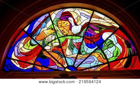 FATIMA, PORTUGAL - SEPTEMBER 17, 2017 Mary Rose Stained Glass Basilica of Lady of Rosary Fatima Portugal. Church created on site where three Portuguese Shepherd children saw Virgin Mary of the Rosary. Basilica created in 1953.