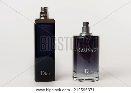 Brnenec, Czech Republic-December 5,2017: Two bottles of the fragrance for women Dior Addict and for men Dior Savuage on white background.