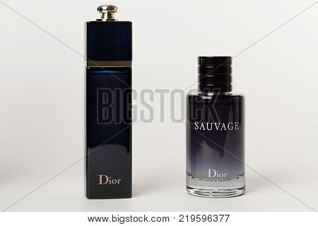 Brnenec, Czech Republic-December 5,2017: Two bottles of the fragrance for women Dior Addict and for men Dior Savuage on white background.