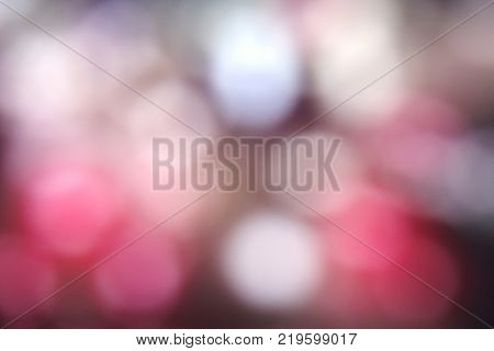Abstract blur of illumination in public park. Blurred background. Copy space. Colorful.