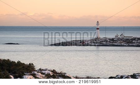 Sea view to the Torungen lighthouse a cold colorful winter evening