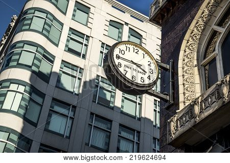 large outdoor clock on brick building in metropolitan city