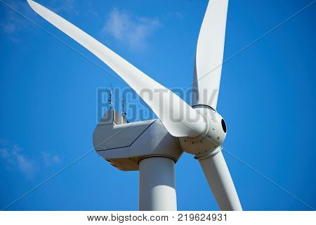 Wind power stations.
Wind power is the use of air flow through wind turbines to mechanically power generators for electric power. A wind farm is a group of wind turbines in the same location used for production of electric power.