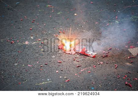Firecracker exploding in the street for the chinese new year celebration