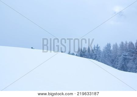 snowy and foggy mountain winter landscape in luesen South Tirol Italy