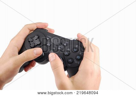 Hands playing with a smartphone game controller isolated on white background