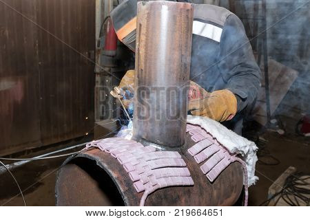 Welder In The Shop Weld Sample From The Tube With Concomitant Heating For Attestation