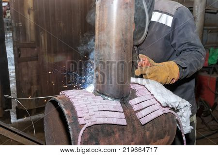 Welder In The Shop Weld Sample From The Tube With Concomitant Heating For Attestation