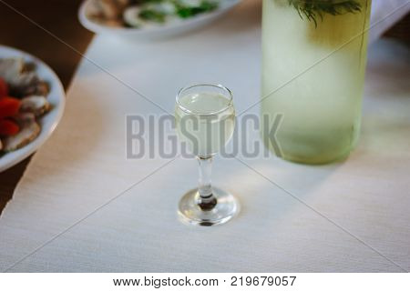 Russian vodka in glass on holiday table