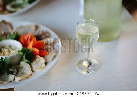 Russian vodka in glass on holiday table