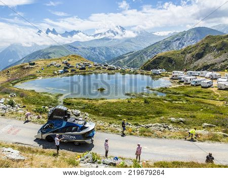 Col de la Croix de Fer France - 25 July 2015: Festina caravan driving on the road to the Col de la Croix de Fer in Alps during the stage 20 of Le Tour de France 2015. Festina is a very old and famous company which produces high quality watches.