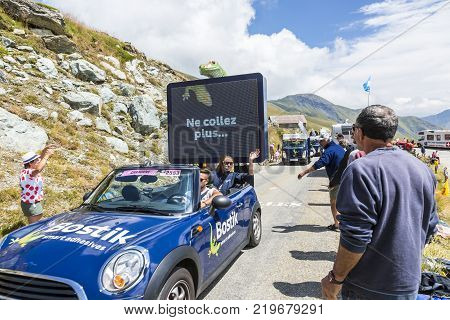 Col de la Croix de Fer France - 25 July 2015: Bostik caravan driving on the road to the Col de la Croix de Fer in Alps during the stage 20 of Le Tour de France 2015.