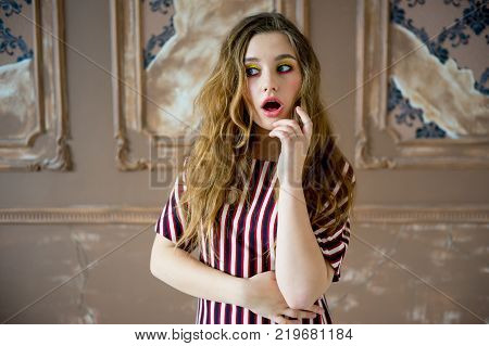 A portrait of a teen girl model in a stdio