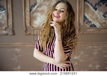A portrait of a teen girl model in a stdio