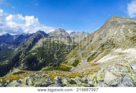 Picturesque summer view of High Tatras mountains near Popradske Pleso Slovakia. Trekking to Sedlo pod Ostrvou (1966m). Mount Ostrva (1984m) on the right. Mount Kopky (2354m) in the center