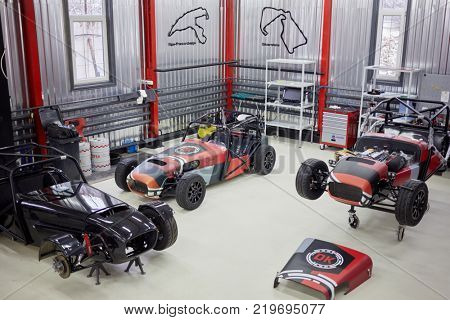 MOSCOW, RUSSIA - OCT 27, 2017: (PR) Several racing cars ShortCuts  based on the legendary Lotus Seven on wheeled rack in garage of DB 527 company producer of russian sports cars.