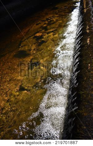 A small waterfall off the side of a water crossing
