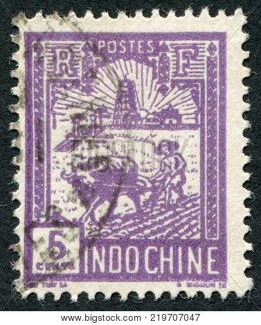 INDOCHINE-CIRCA 1927: A stamp printed in the Indochine shows the Tran Quoc Pagoda circa 1927
