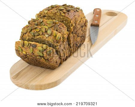 Freshly baked bread from wheat flour with sunflower seeds, pumpkin, sesame isolated on a white background. Baking for a healthy diet.