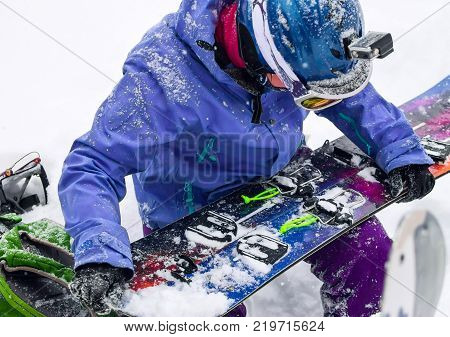 Woman Freerider Installs Splitboard, In Snow Wild Mountains
