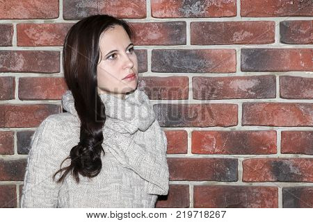 Portrait Of The Young Woman Up To Shoulders At A Wall
