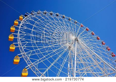 Ferris wheel at Issyk-Kul.
A Ferris wheel is a nonbuilding structure consisting of a rotating upright wheel with multiple passenger-carrying components.