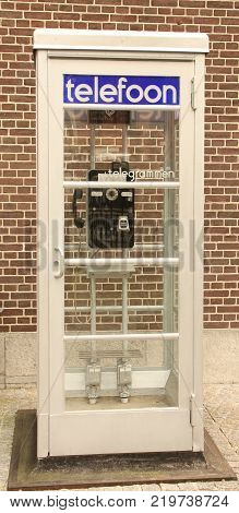 Amsterdam.October-17-2017. Phone booth in the garden of the Rijksmuseum in Amsterdam. The Netherlands