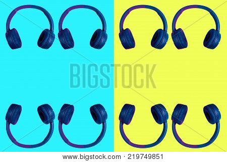 Multiple doubled wireless headphones on vivid two colored background in cyan and yellow. Flat minimal style. Design and colors